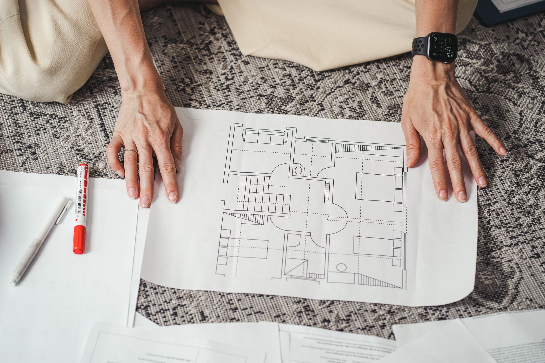 Person reviewing a project floor plan