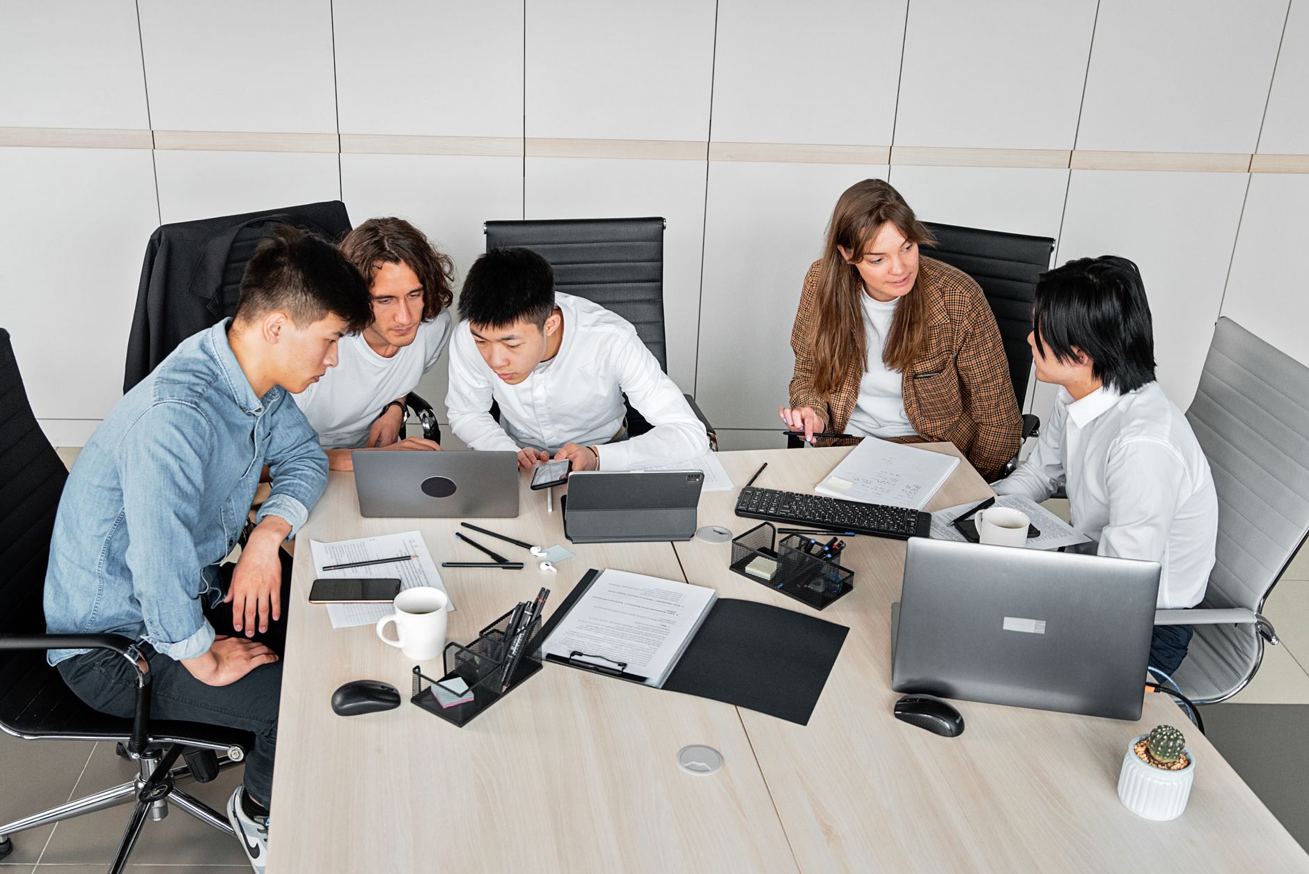 Team discussing a project recovery plan in an office